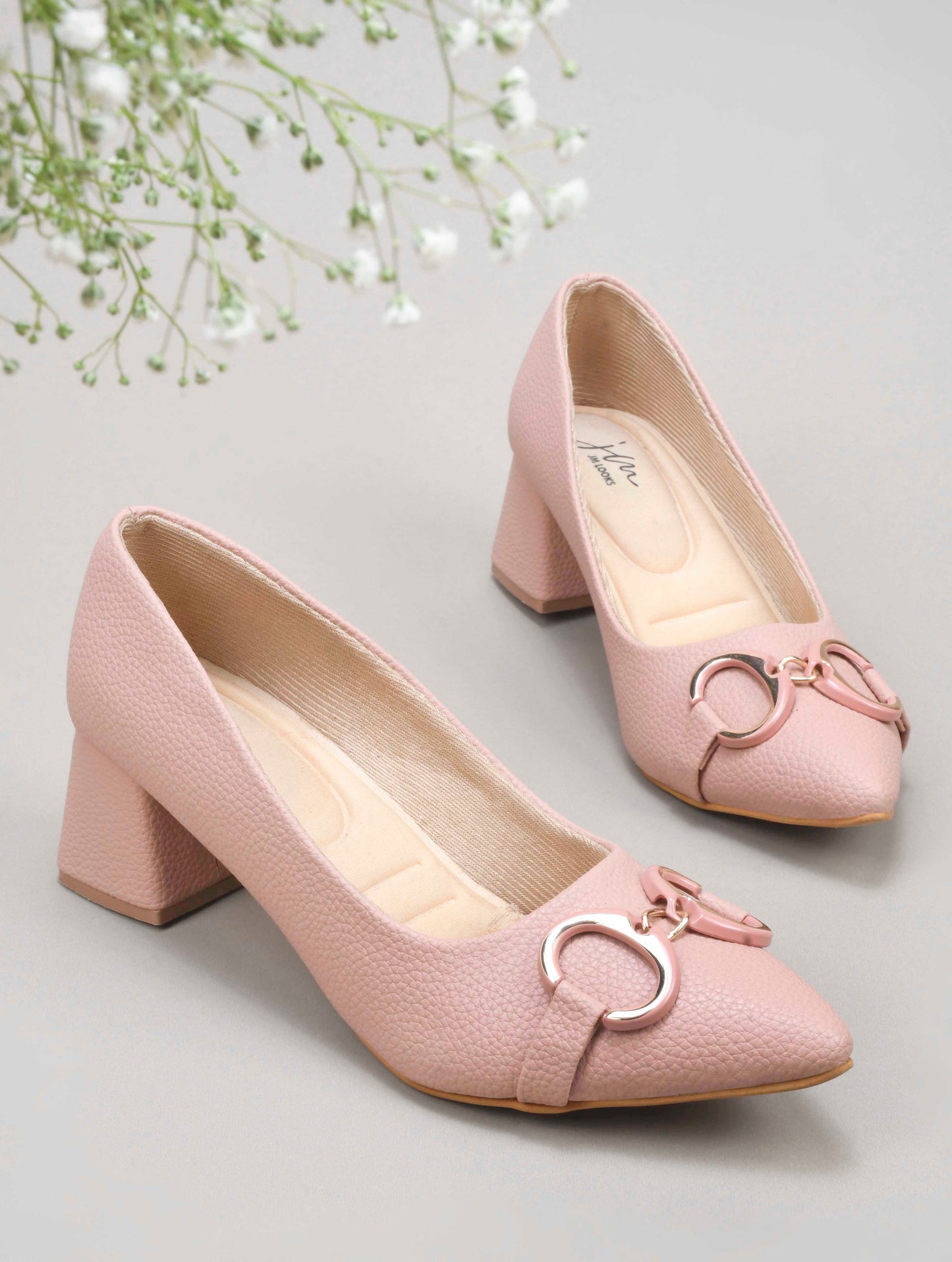 women's block heel pumps featuring a pointed toe and a decorative buckle embellishment
 Peach