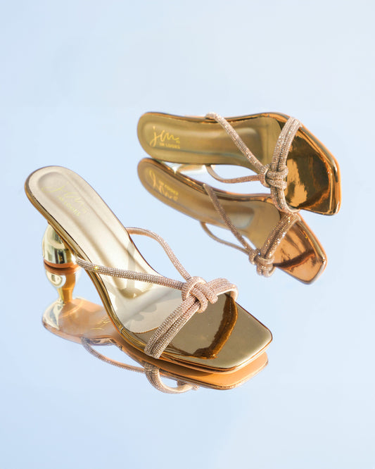 embellished strappy heeled sandals with a unique sculpted heel
 Golden