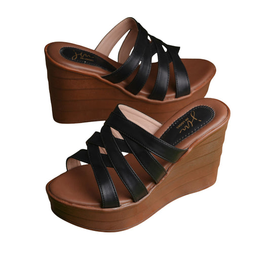 Black strappy crisscross platform wedge heels for women with brown sole and slip-on open-toe design.