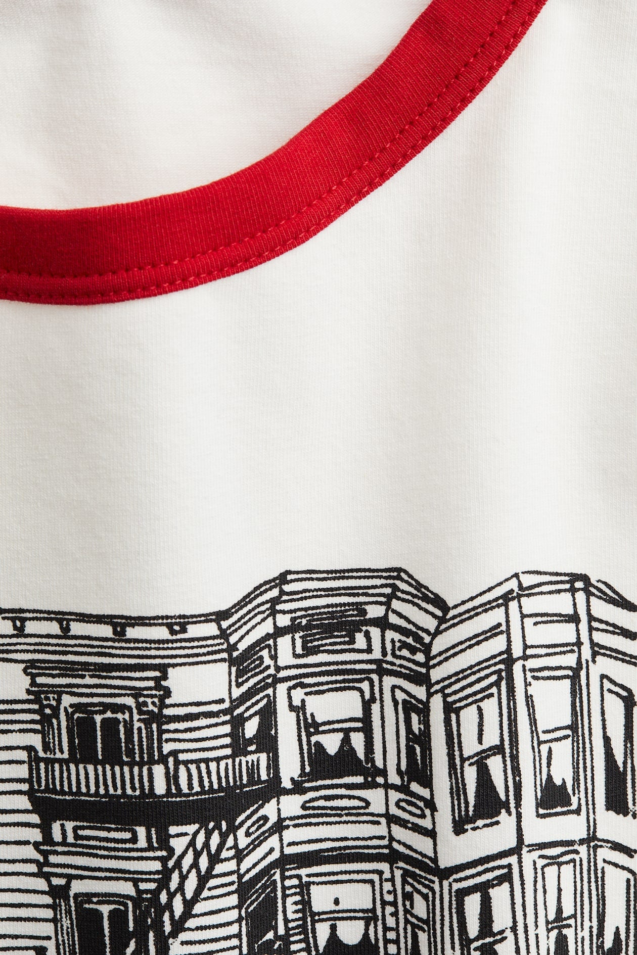White graphic ringer crop top tee with red trims, New York cityscape print and short sleeves