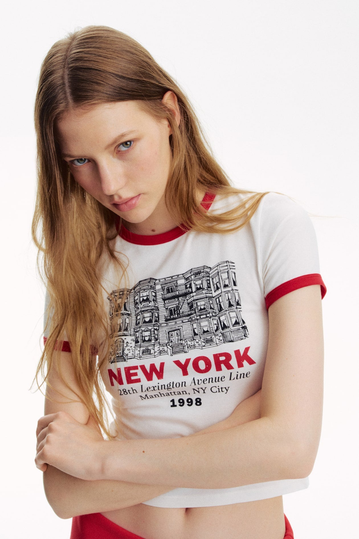 White graphic ringer crop top tee with red trims, New York cityscape print and short sleeves