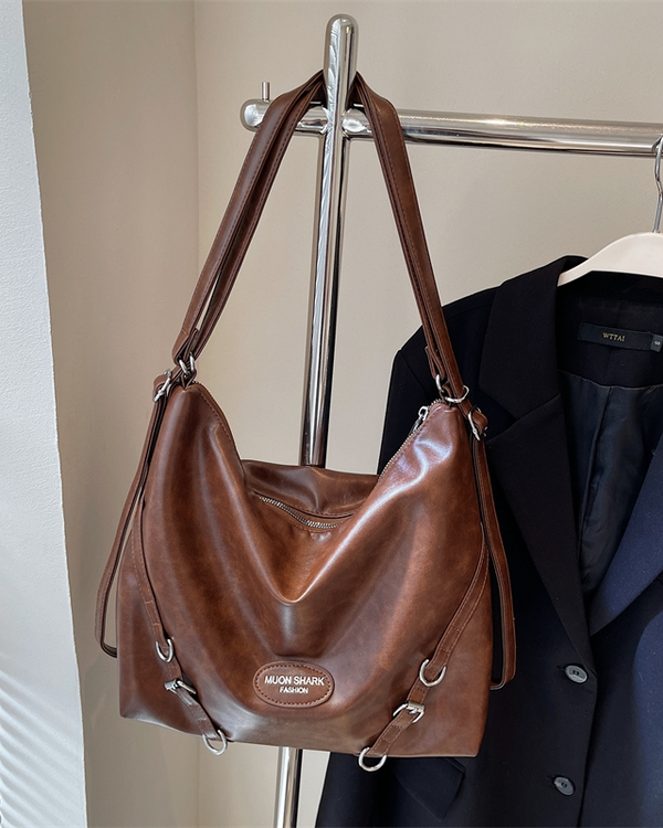 Brown slouchy hobo shoulder bag in sumptuous distressed leather with silver hardware and adjustable crossbody straps