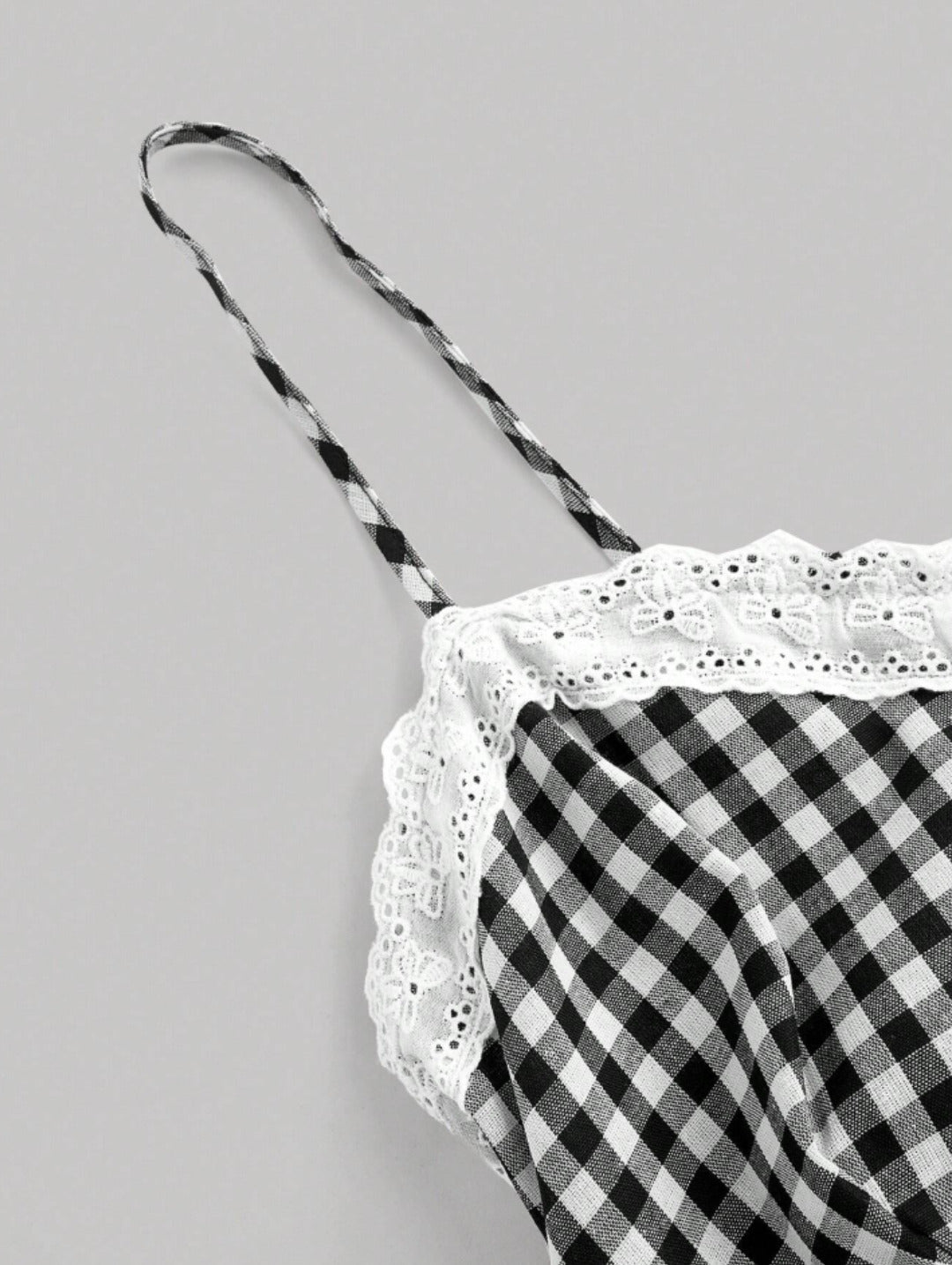 Black gingham lace trim mini dress with sweetheart neckline, bow detail, adjustable straps, and scalloped hem
