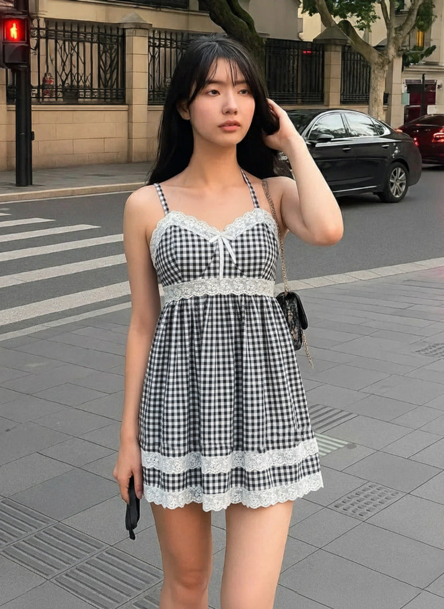 Black gingham lace trim mini dress with sweetheart neckline, bow detail, adjustable straps, and scalloped hem