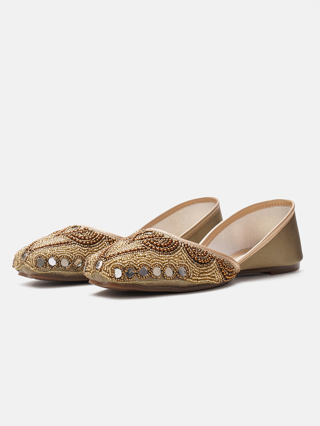 traditional juttis heavily embellished with pearls and beads on the upper
 White