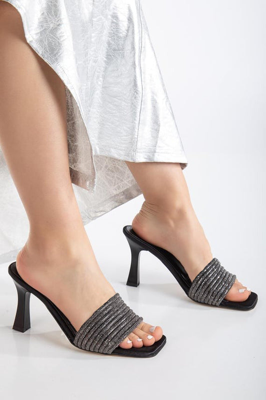 pen-toe high-heeled mules with an embellished wide strap and a contemporary square toe
 Grey