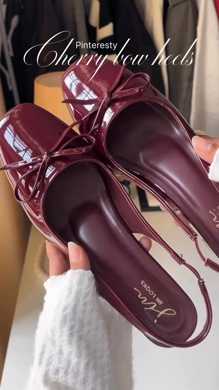 Women's cherry patent Mary Jane slingback block heels with bow detail, square toe and chunky heel.