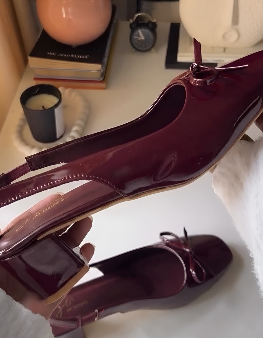 Women's cherry patent Mary Jane slingback block heels with bow detail, square toe and chunky heel.
