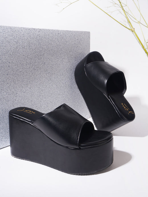 Black wedge platform heels for women, open toe slip-on style with chunky high heel sole.