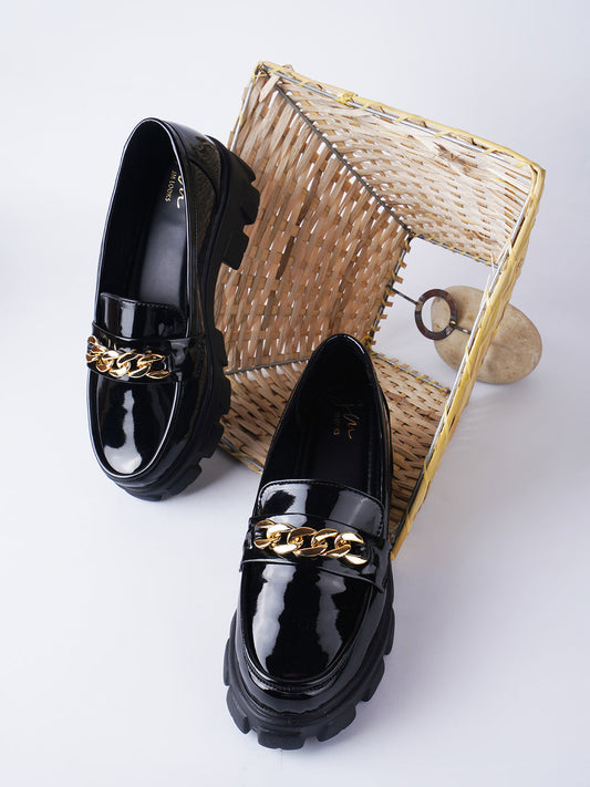 Black Women's glossy patent loafers with chunky sole and chain detail, slip-on style